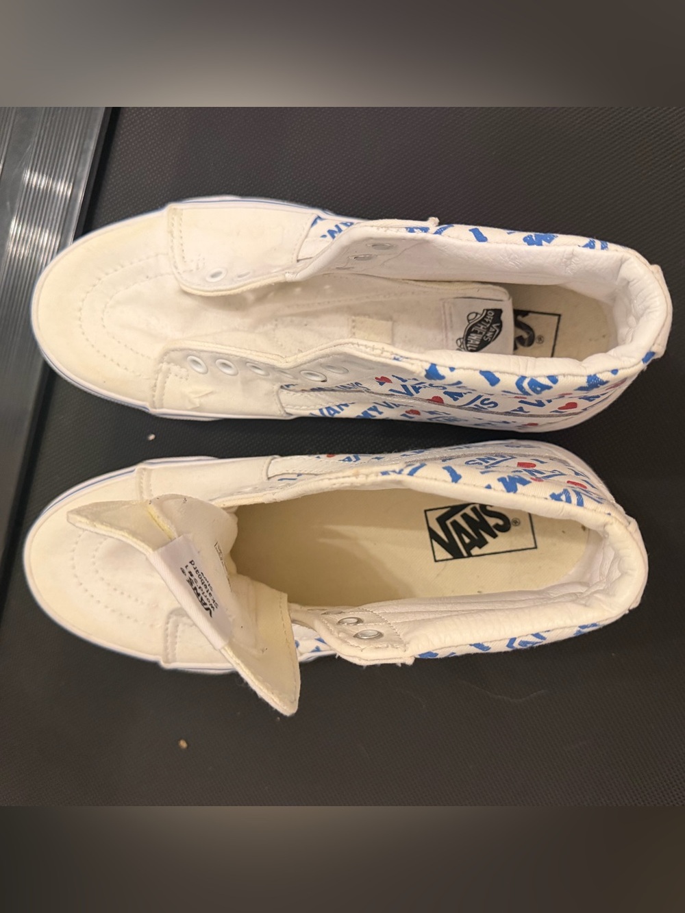 Vans White Canvas Slip-On Sneakers with Blue & Red Accents